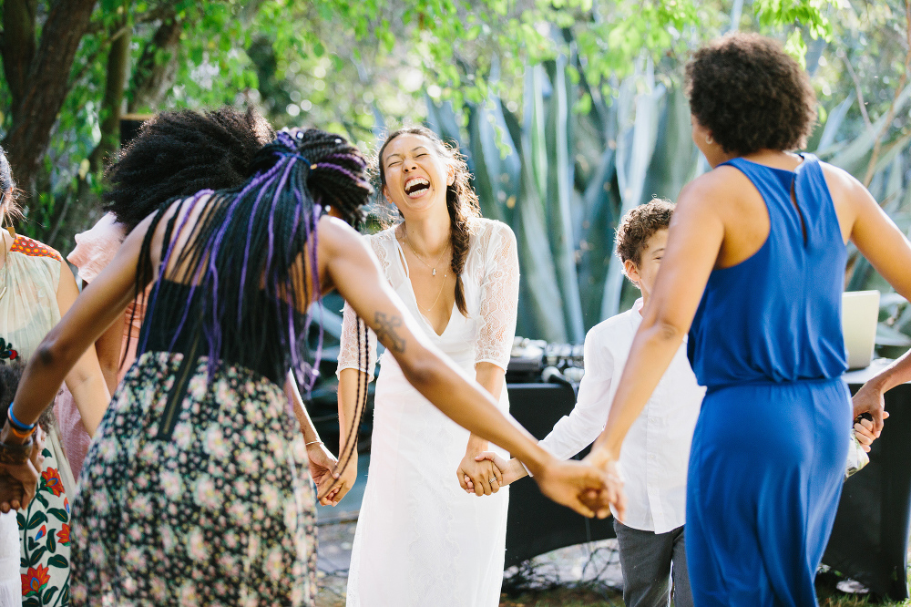 Lydia dancing in a circle with her friends. 