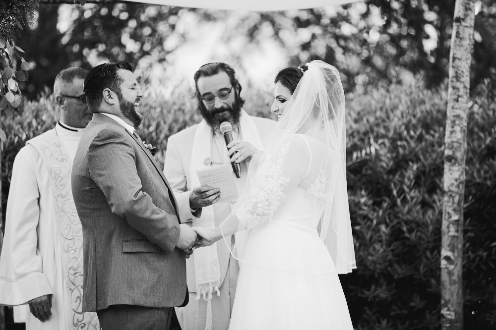 The couple laughing during the ceremony. 