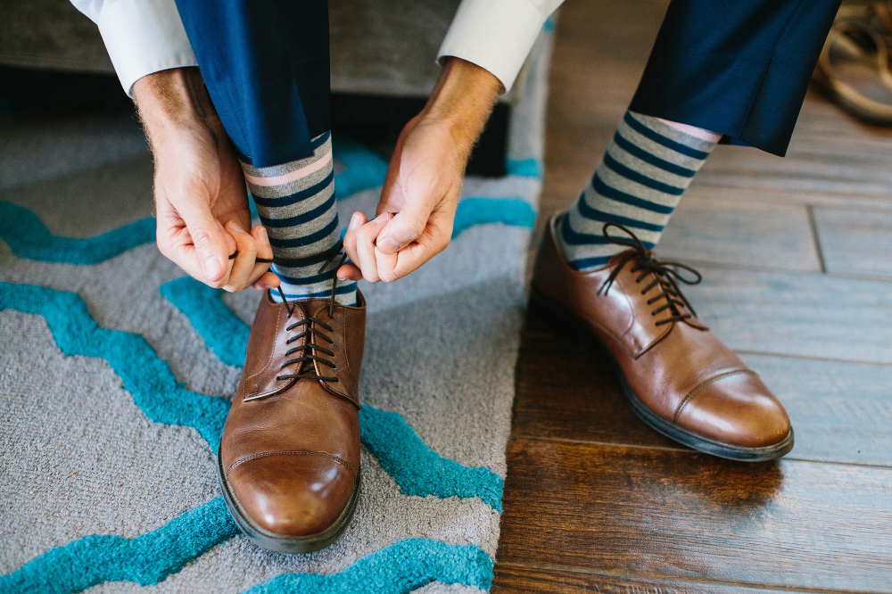 Matt putting on his shoes. 