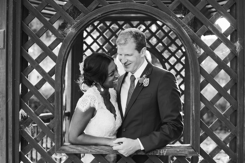 A cute black and white photo of the couple laughing. 