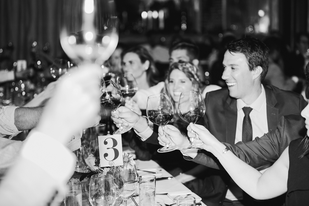 The wedding guests toasting the Newlyweds. 