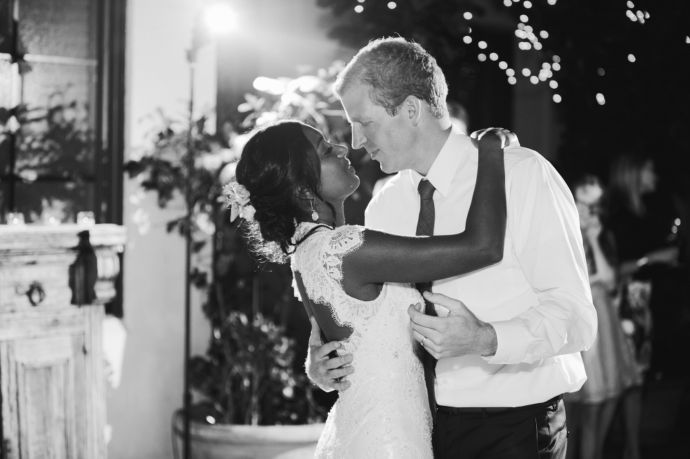 The bride and groom dancing together. 