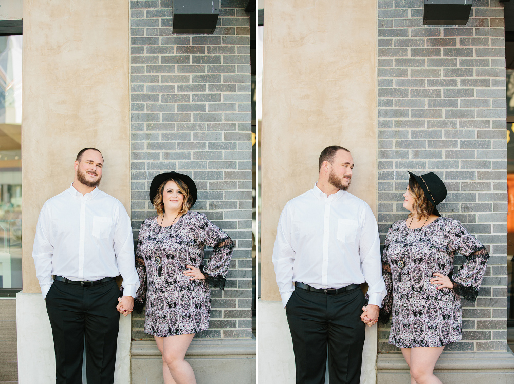 Jason and Amanda standing in front of two different walls. 