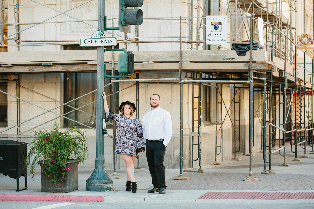 The couple crossing the street. 