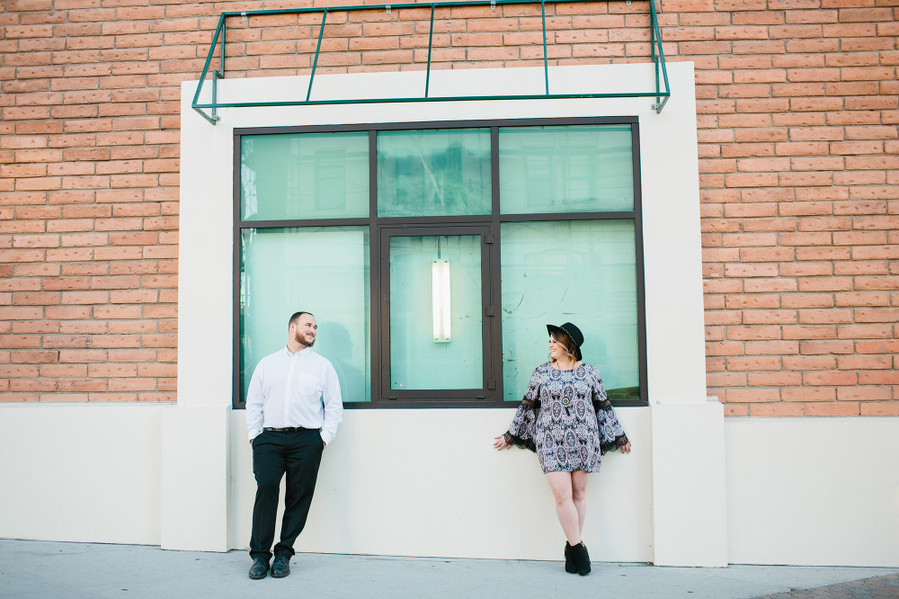 Jason and Amanda outside of a brick building. 