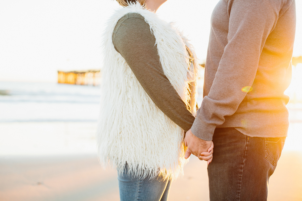 Amanda and Jason holding hands. 