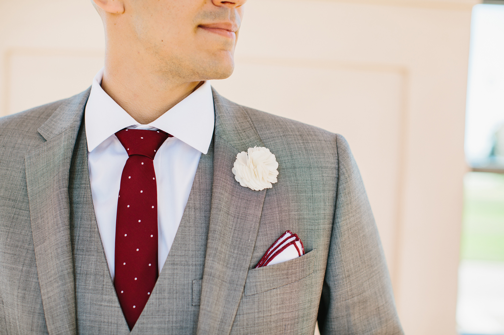 A photo of the groom's suit and details. 