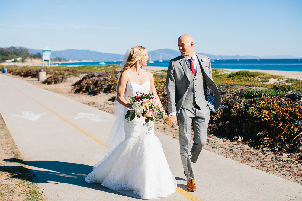 Bailey and Phil walking on the beach together. 