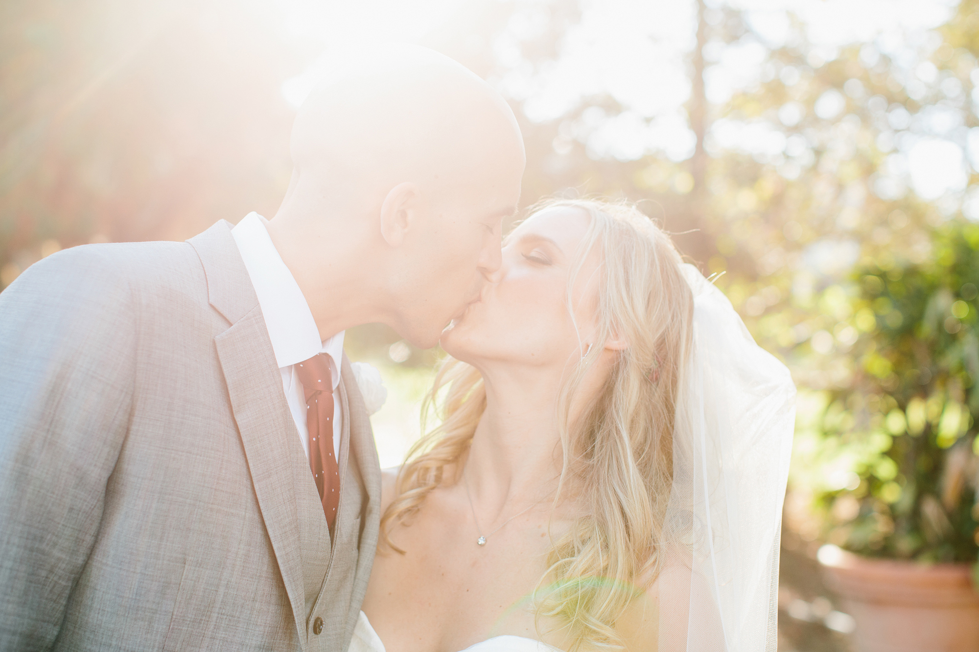 A beautiful sun filled photo of the bride and groom. 