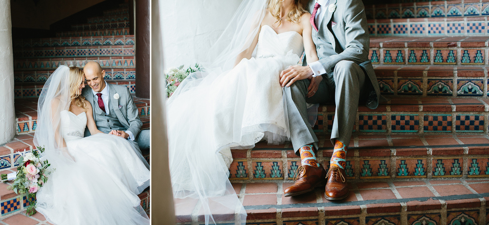 The bride and groom sitting on steps together. 