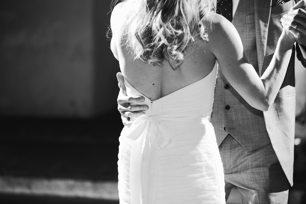 A beautiful black and white photo of the bride and groom dancing. 