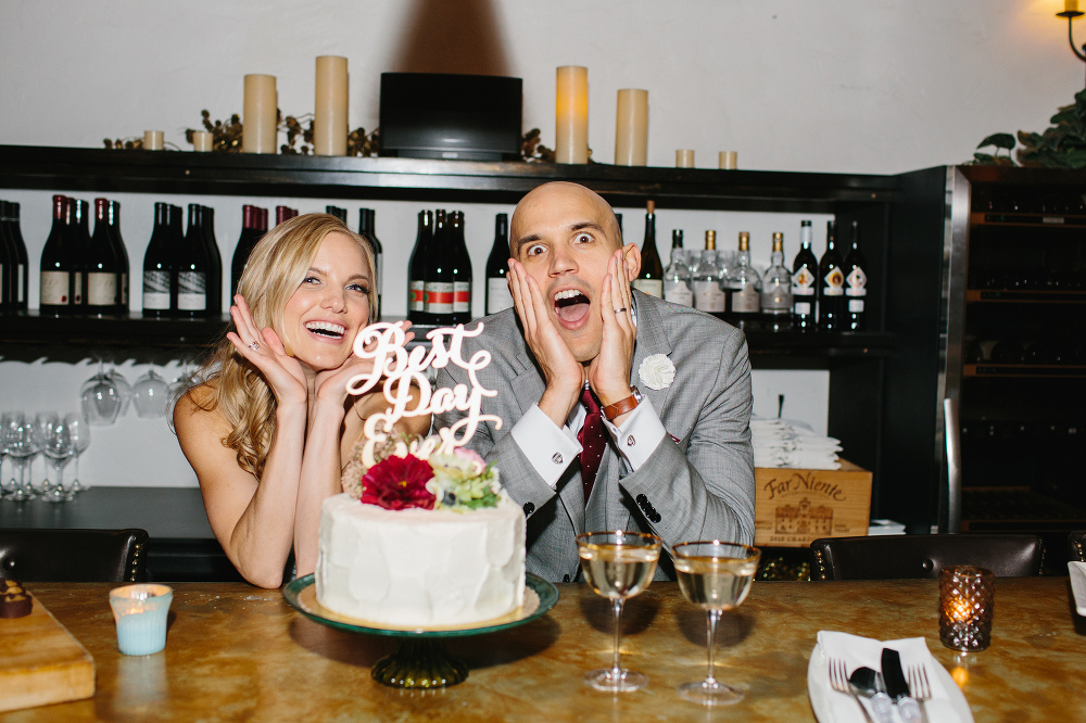 A silly photo of the bride and groom before cake cutting. 