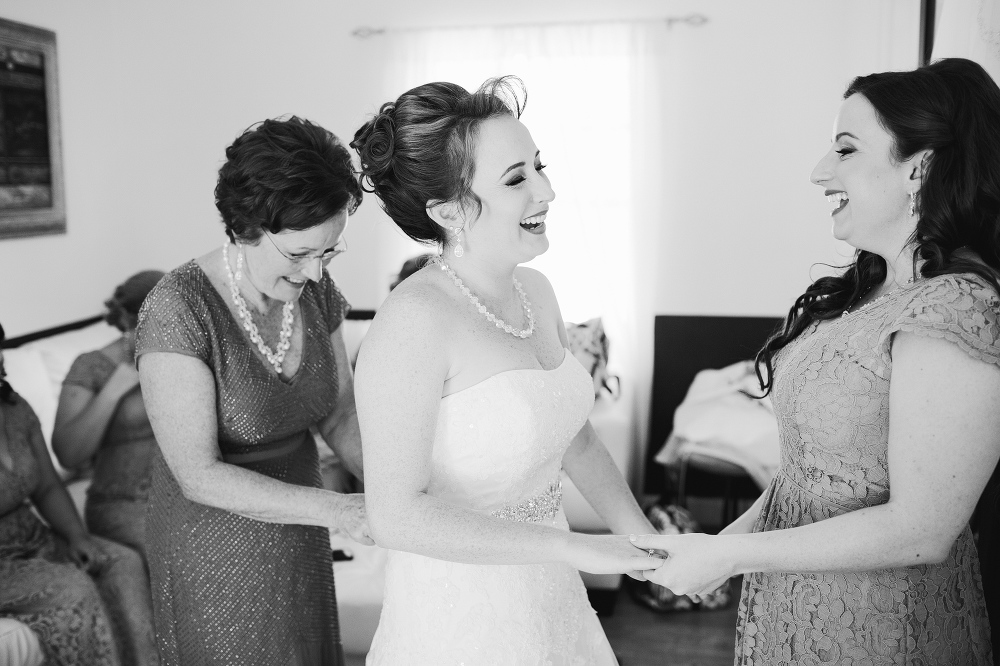 A sweet photo of the bride laughing with her sister. 
