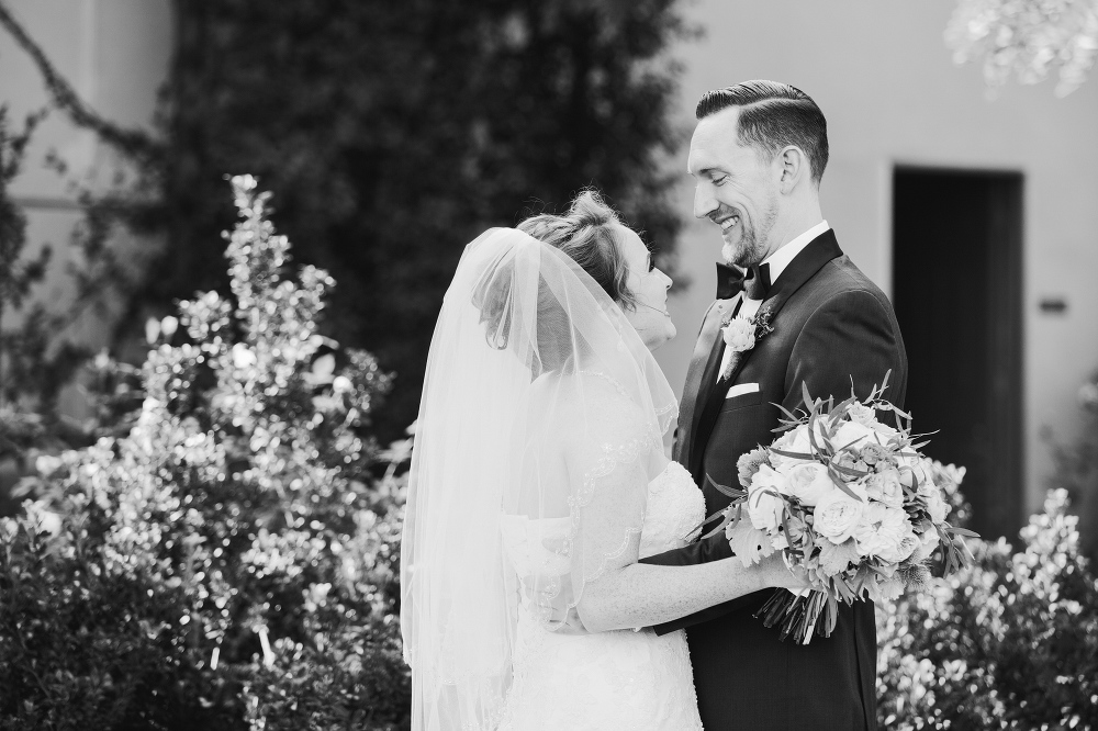 The bride and groom laughing together. 