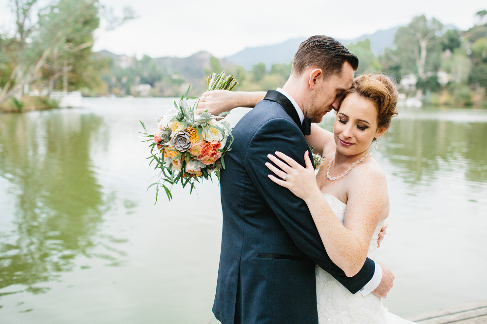 A beautiful portrait of the newlyweds by the lake. 