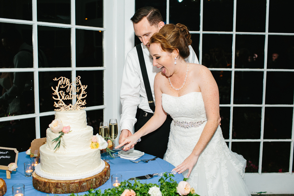 The bride and groom cutting the cake. 