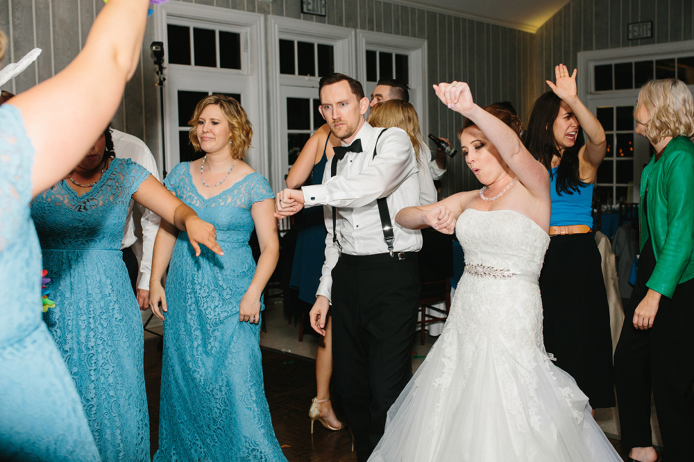 The bride and groom dancing with the bridesmaids. 