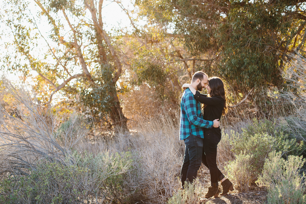 Desi and Curtis in front of beautiful trees. 