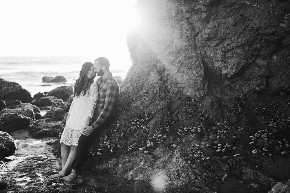 A black and white photo of the couple looking at each other. 