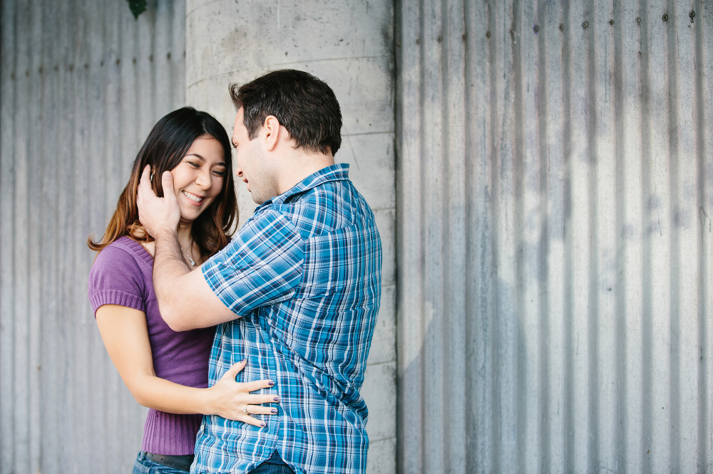 A sweet photo of Janice and Mike in front of a gray wall. 