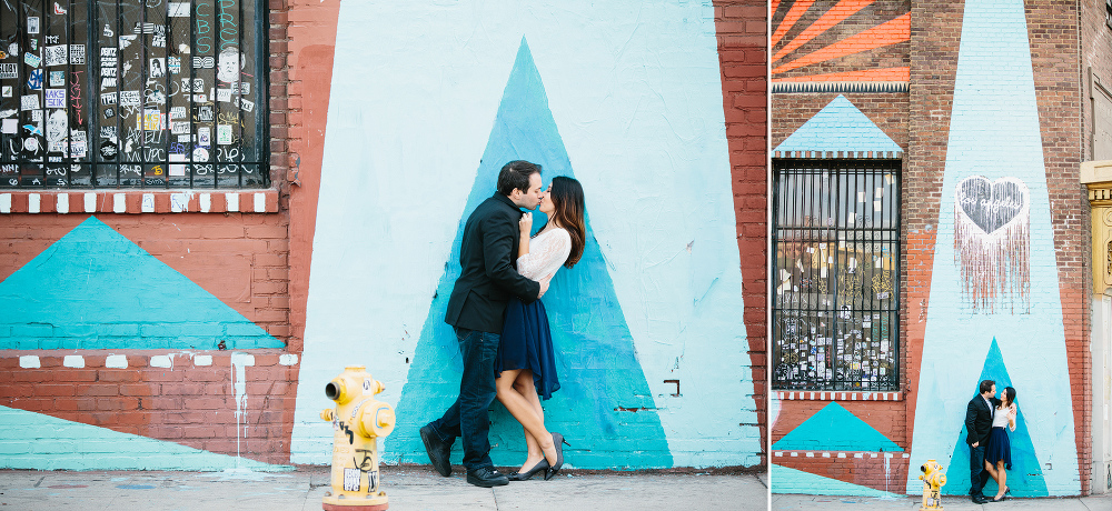 The couple in front of a blue triangle. 