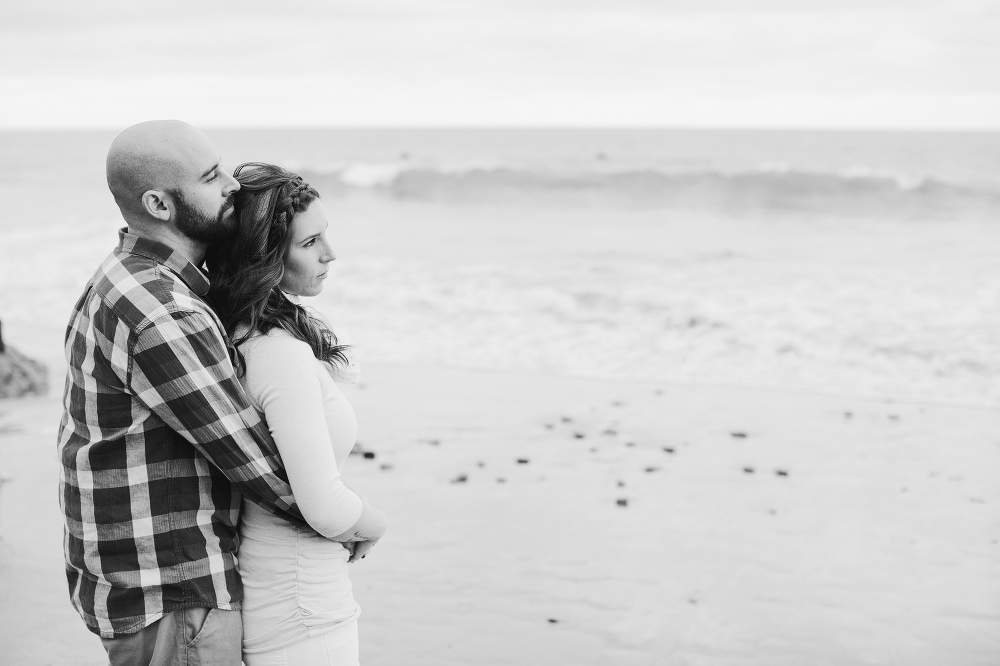 The couple looking out at the beach. 