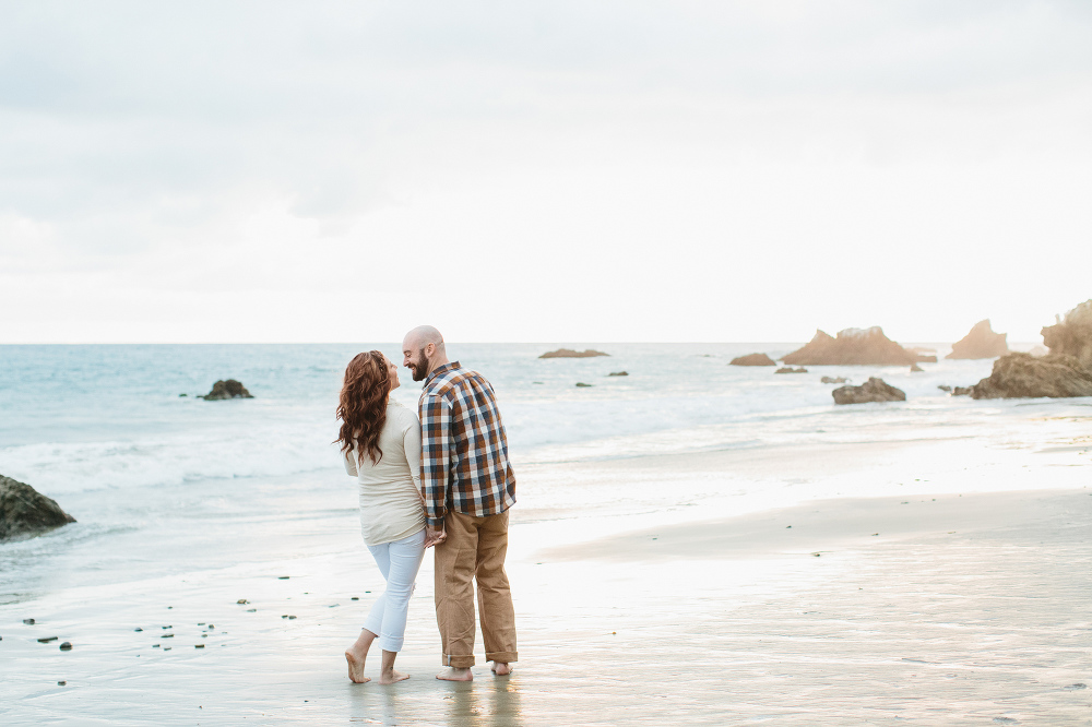 The couple walking along the beach. 