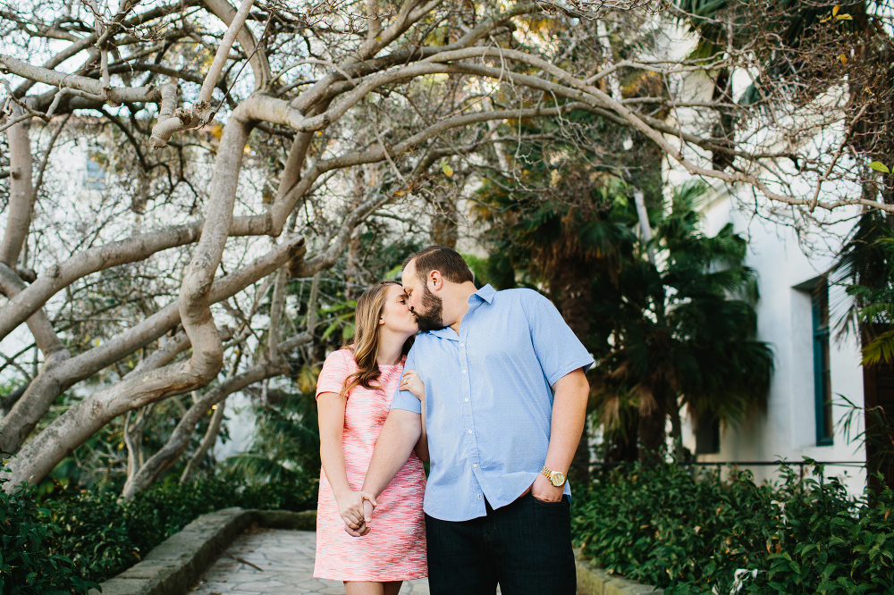 Sarah and Andrew in front of the a building under a tree. 