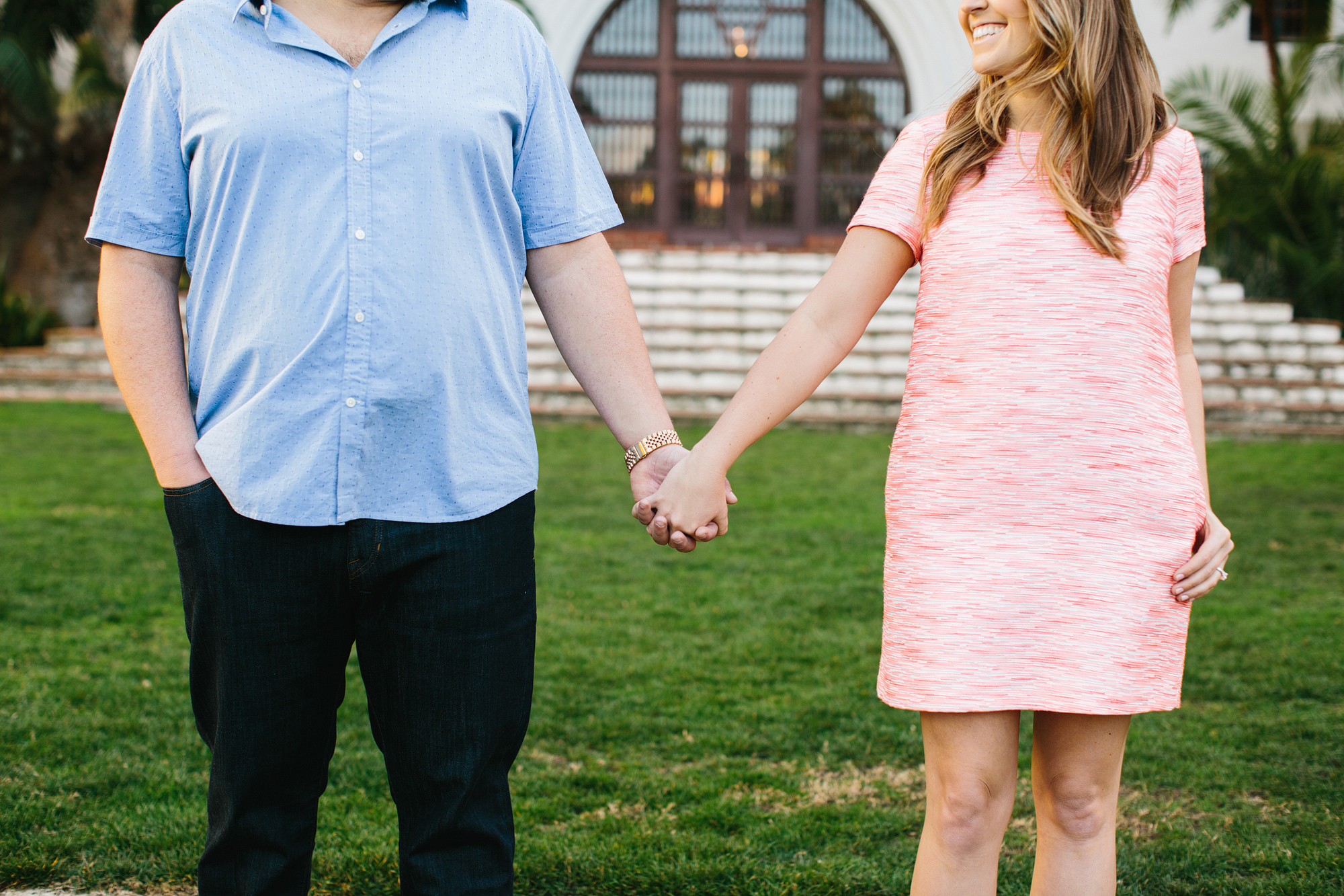 A cute photo of the couple holding hands. 