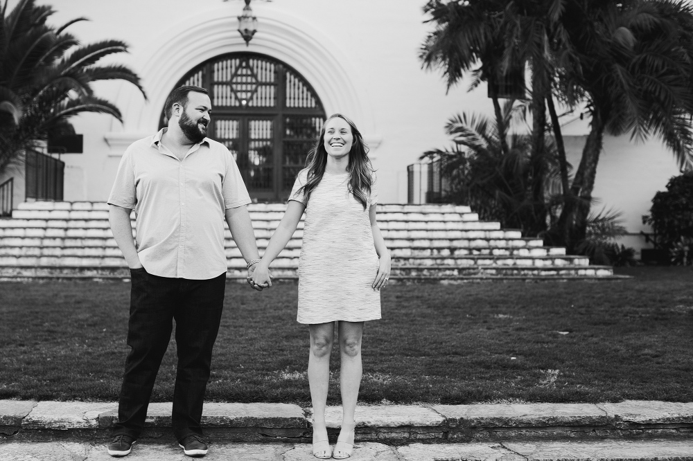 A black and white photo of the couple laughing. 