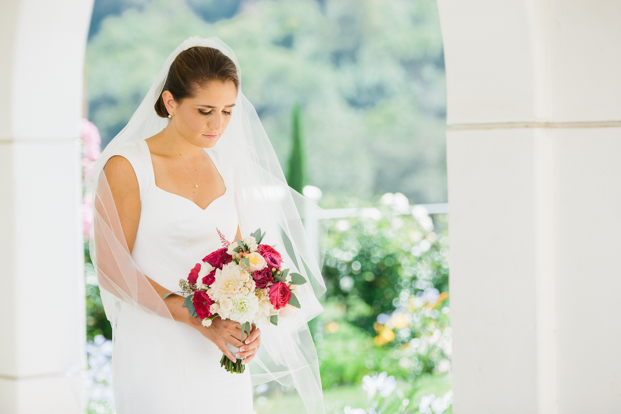 A beautiful portrait of the bride holding her bouquet. 