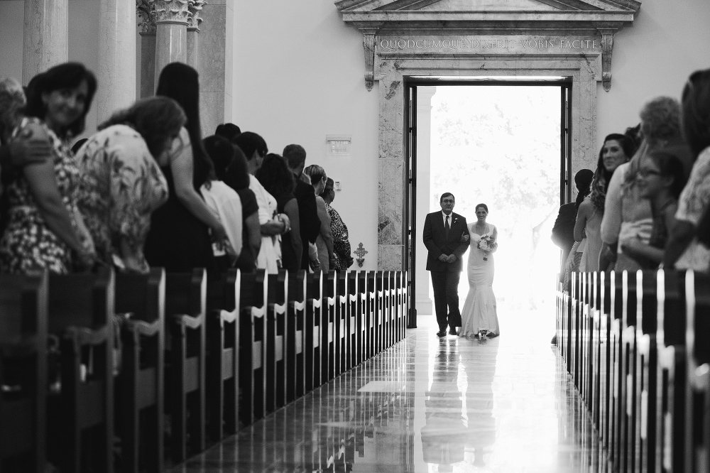 The bride entering the ceremony with her dad. 