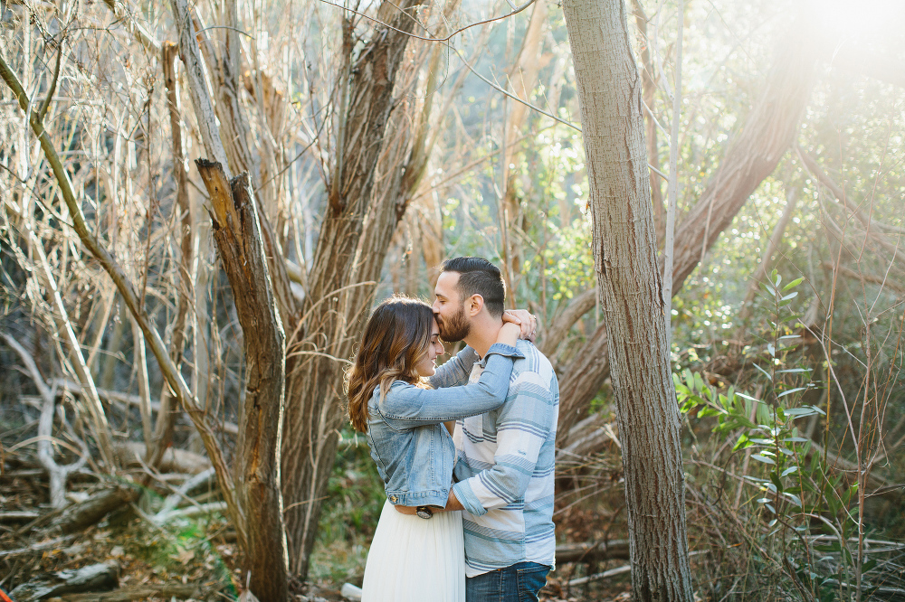 The couple surrounded by trees. 