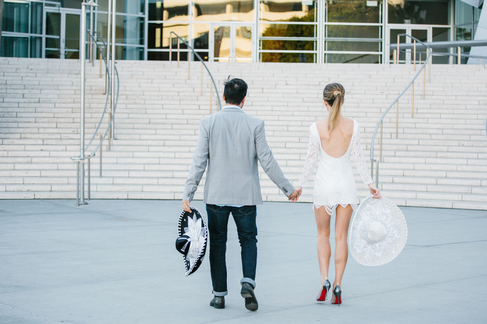 The couple walking toward the stairs. 