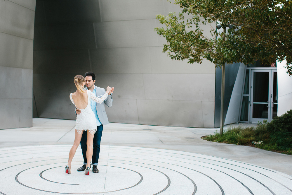 Ashley and Luis dancing in a circle. 