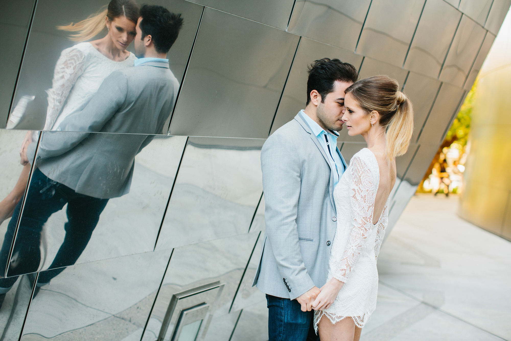 Ashley and Luis with their reflection on the building. 