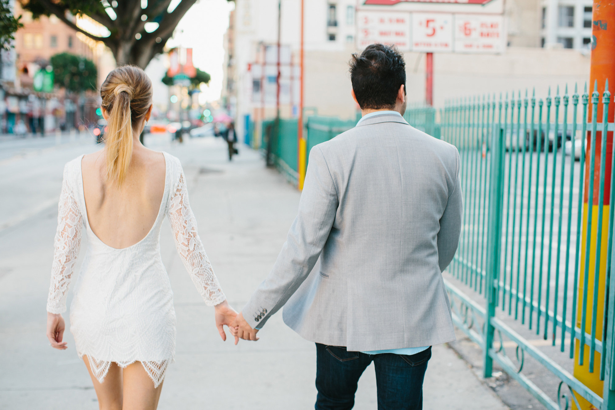 The couple walking along the street. 