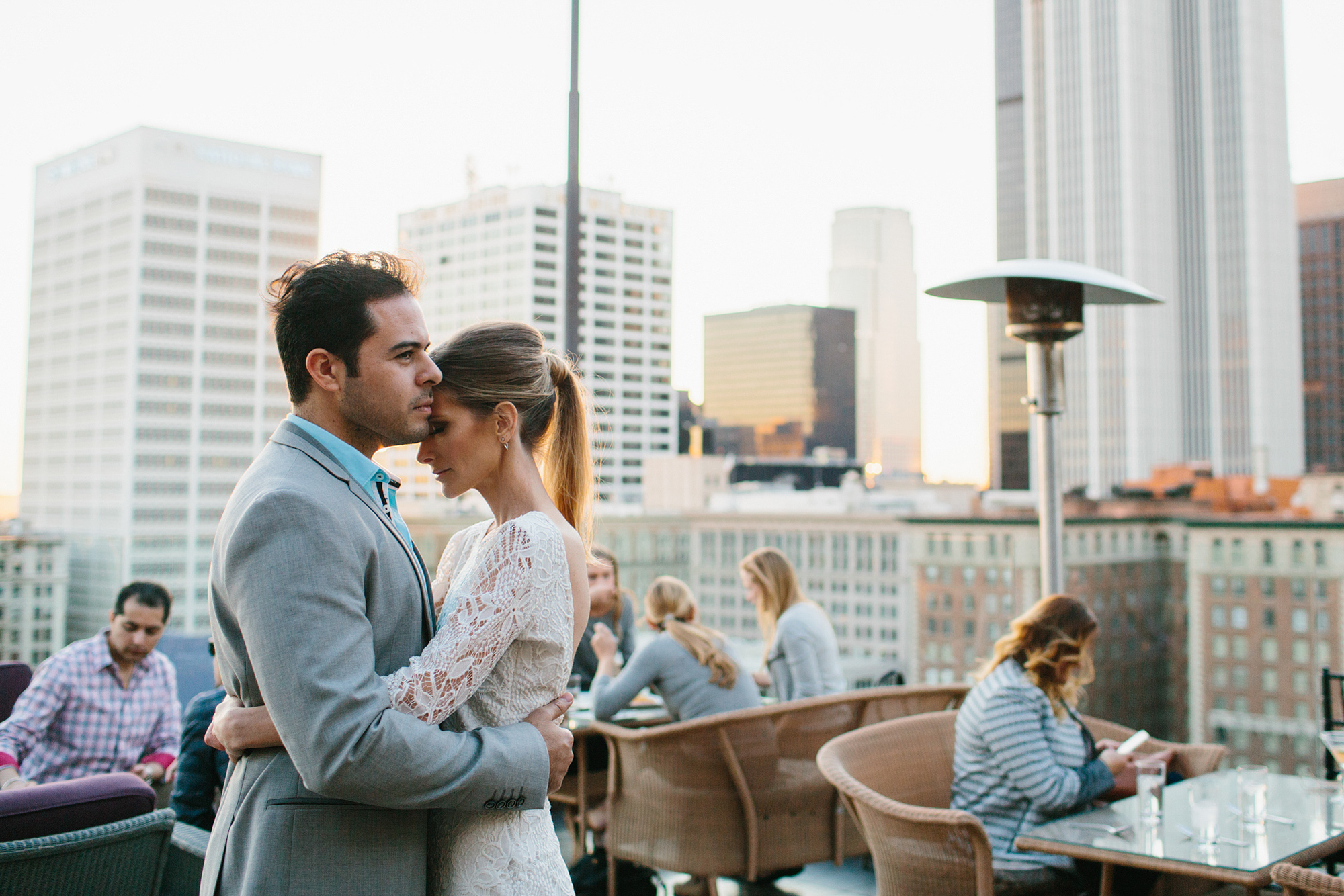 Ashley and Luis at a rooftop restaurant. 