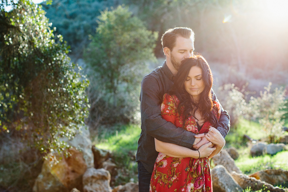 A bright photo of the couple surrounded by nature. 
