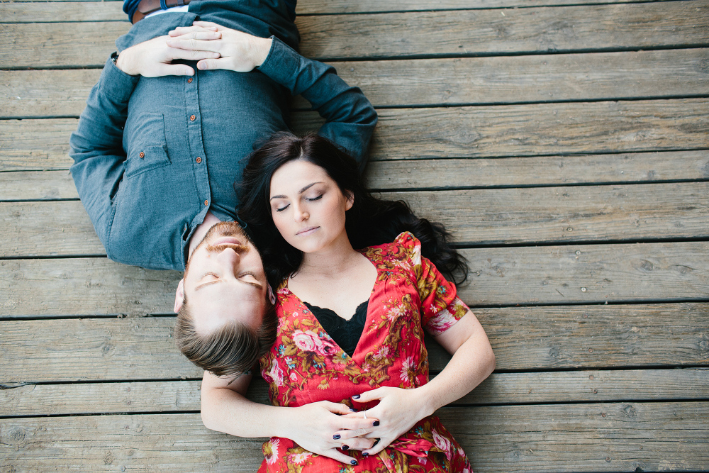 Niky and John laying on a porch. 