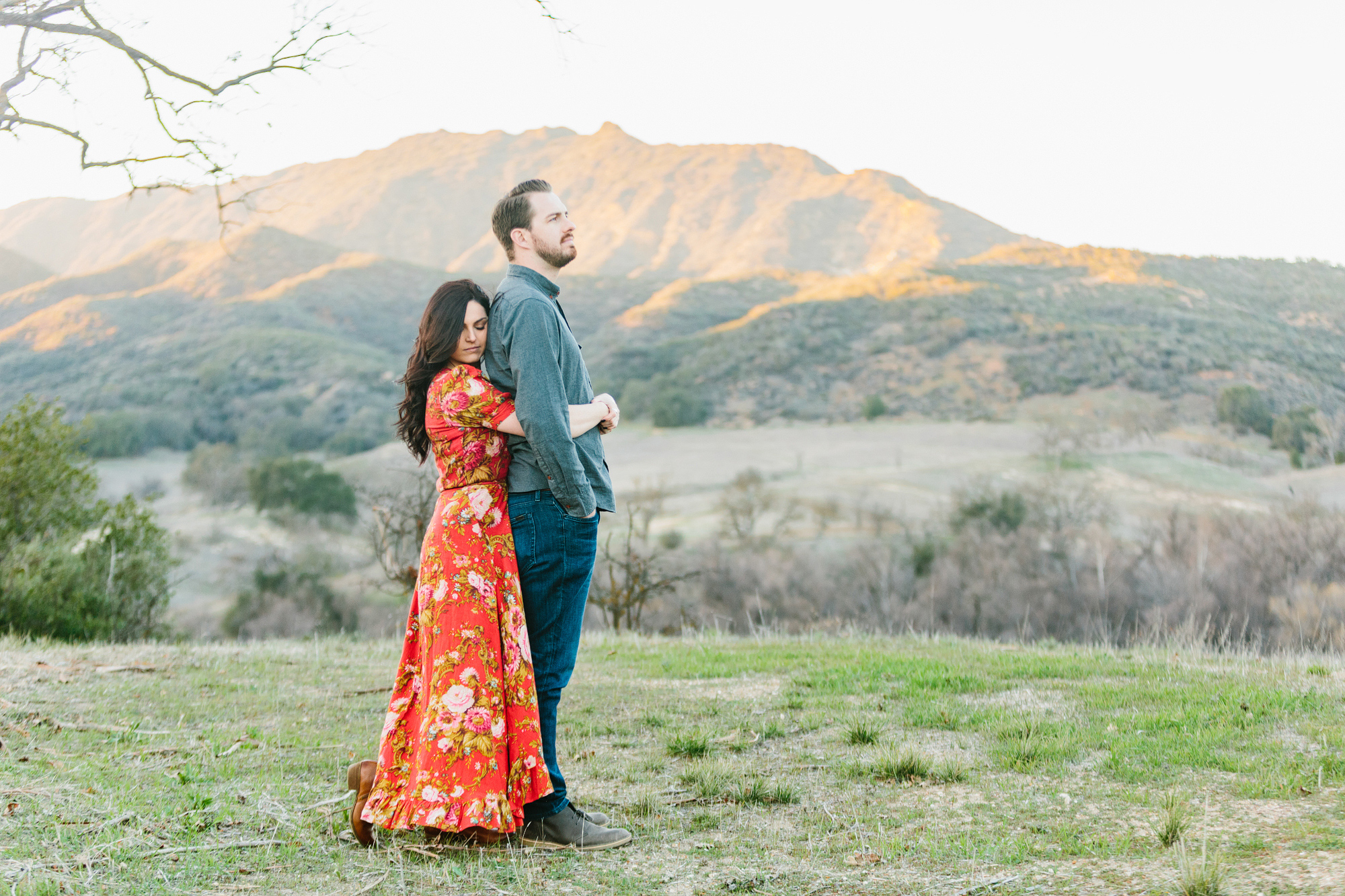 The couple with hills in the background. 