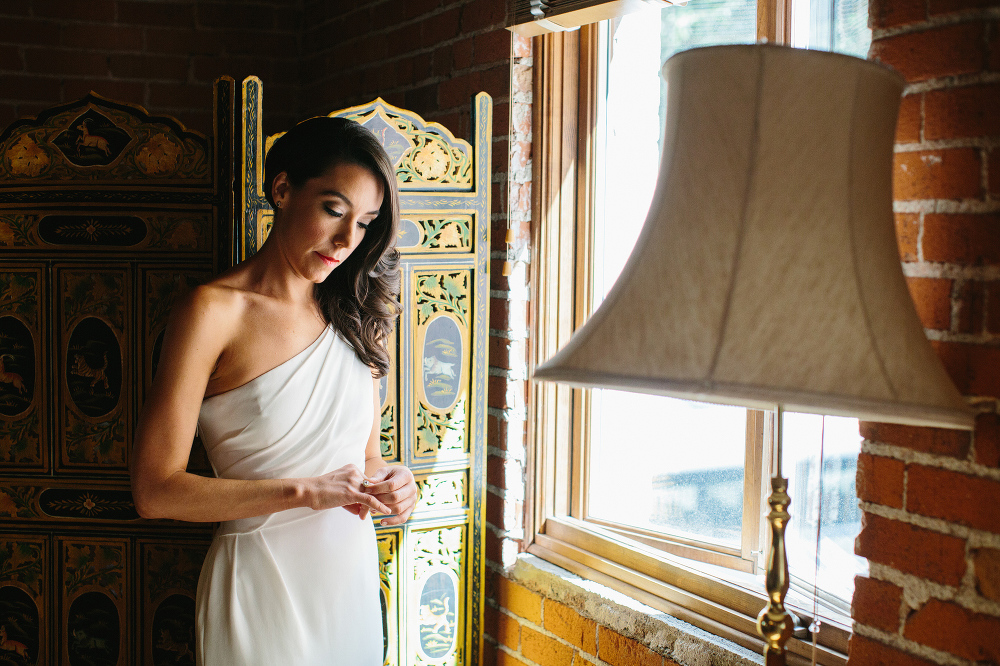 Mary putting on her engagement ring. 