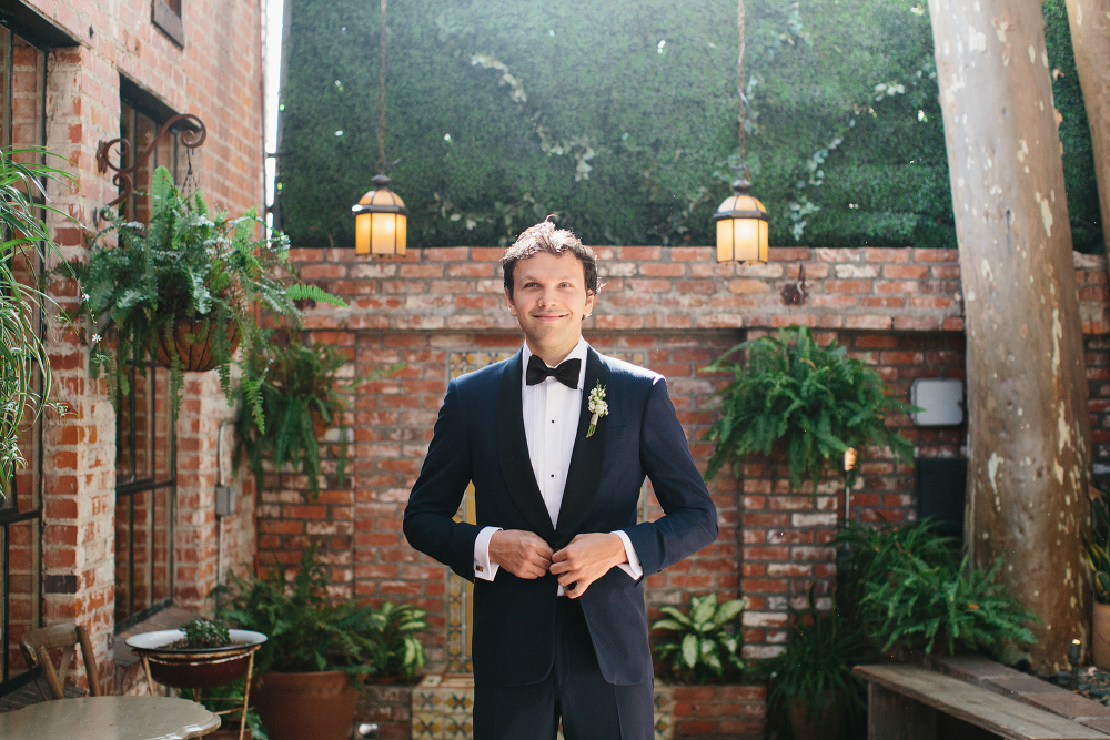 The groom getting ready in the courtyard. 