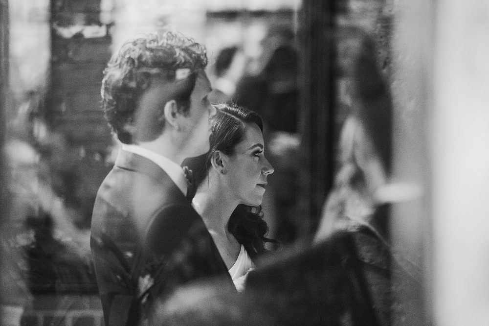 A photo of the couple through the window. 