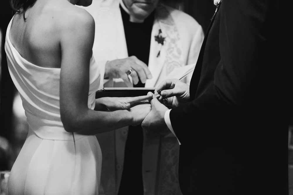 The couple exchanging rings. 