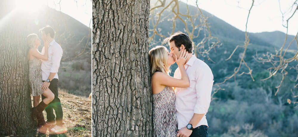 Megan and Travis next to a tree. 