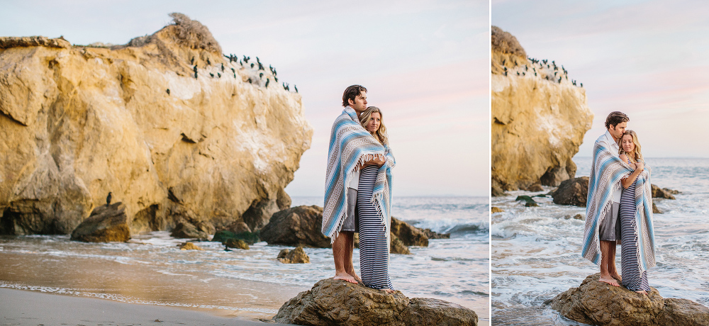 Megan and Travis standing on a rock. 