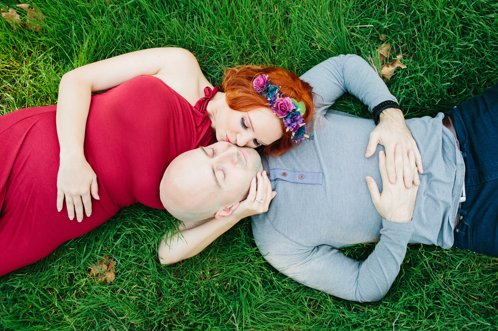 Krystle and Ray laying on the grass. 