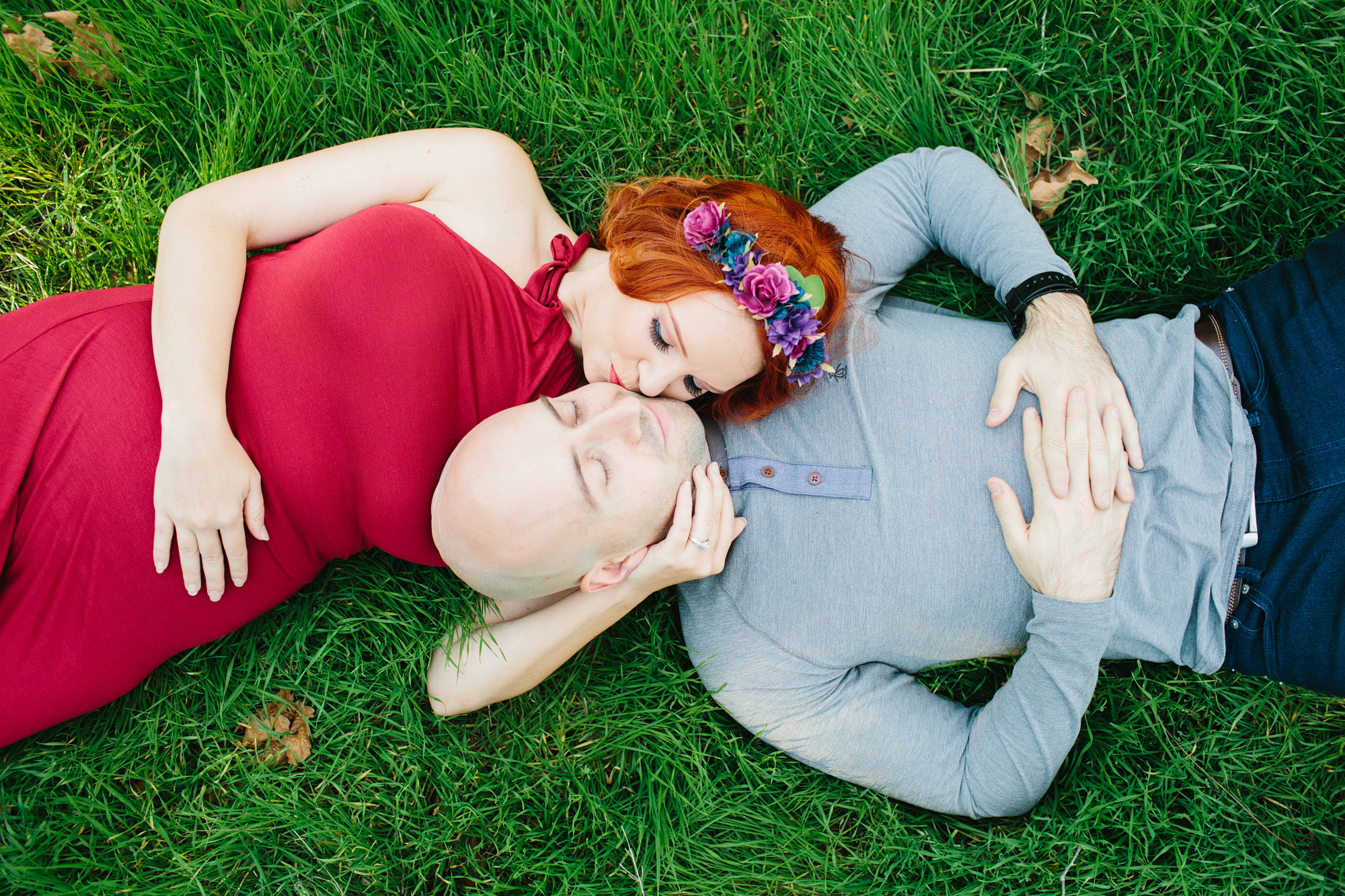 Krystle and Ray laying on the grass. 