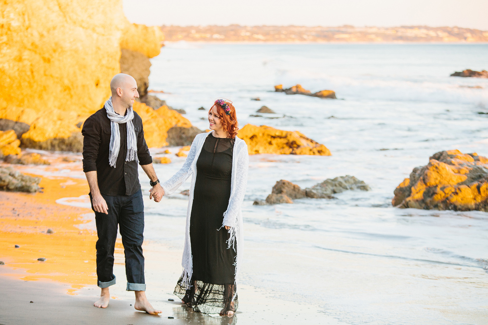 The couple at the beach at sunset. 